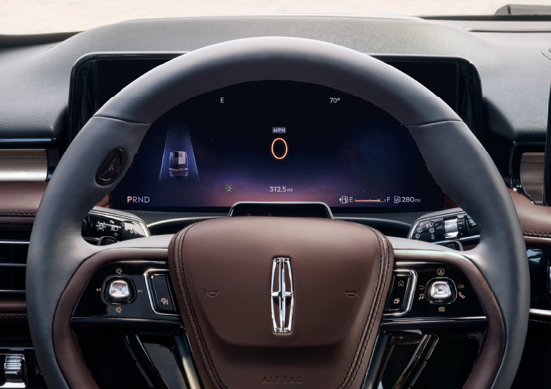 The steering wheel of 2025 Lincoln Aviator® SUV is shown with black and brown accents. | Don Franklin Lincoln Elizabethtown in Elizabethtown KY