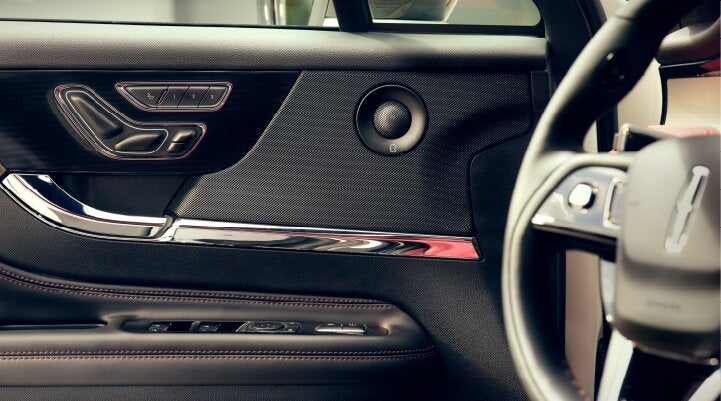 A Revel® audio speaker is shown in the driver's side door of a 2025 Lincoln Corsair® SUV. | Don Franklin Lincoln Elizabethtown in Elizabethtown KY