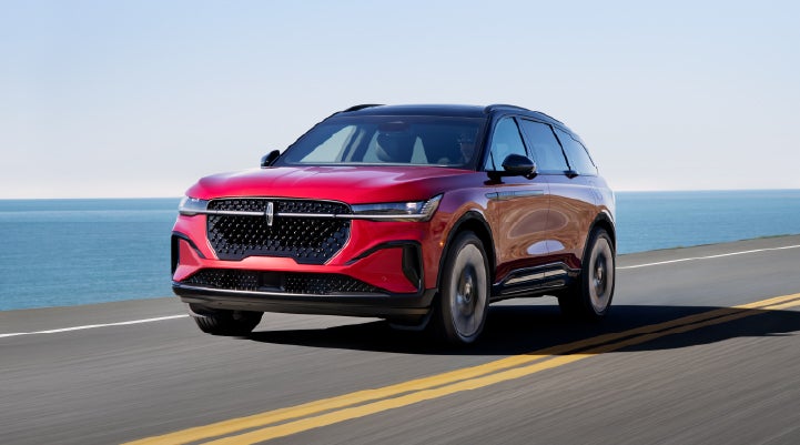 A 2025 Lincoln Nautilus® SUV is being driven on a seaside roadway. | Don Franklin Lincoln Elizabethtown in Elizabethtown KY