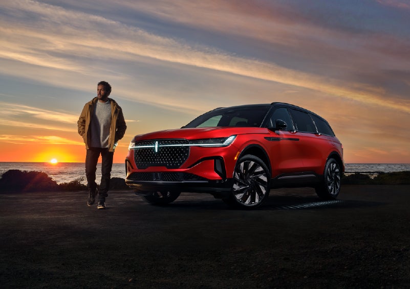 A person is shown next to a 2025 Lincoln Nautilus® SUV as the Lincoln Embrace sequence takes place. | Don Franklin Lincoln Elizabethtown in Elizabethtown KY