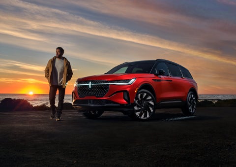 A person is shown next to a 2025 Lincoln Nautilus® SUV as the Lincoln Embrace sequence takes place. | Don Franklin Lincoln Elizabethtown in Elizabethtown KY