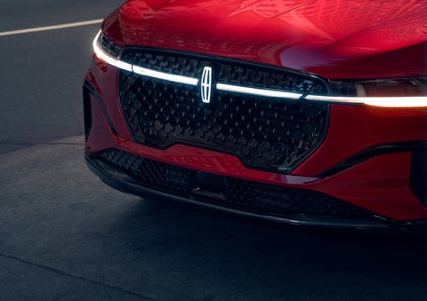 The available front LED light bar and center Lincoln Star logo glow at dusk. | Don Franklin Lincoln Elizabethtown in Elizabethtown KY