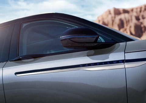 Blue lettering on the side of the vehicle that reads nautilus indicates the available hybrid powertrain. | Don Franklin Lincoln Elizabethtown in Elizabethtown KY