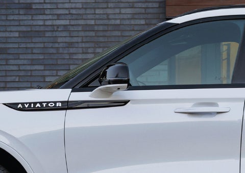 The driver’s side door and fender badging of a white 2026 Lincoln Aviator® SUV are showcased. | Don Franklin Lincoln Elizabethtown in Elizabethtown KY