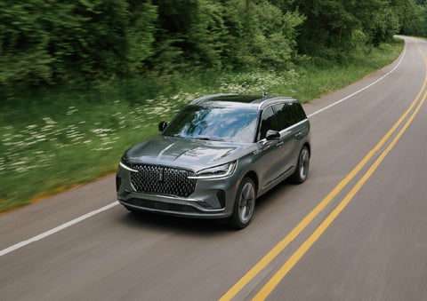 A 2027 Lincoln Aviator® SUV is being driven down a road. | Don Franklin Lincoln Elizabethtown in Elizabethtown KY