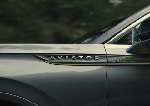 The driver’s side door and fender badging of a gray 2027 Lincoln Aviator® SUV are showcased. | Don Franklin Lincoln Elizabethtown in Elizabethtown KY