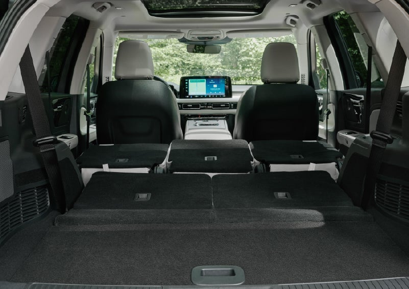 A rear to front view of the interior of a 2027 Lincoln Aviator® Black Label™ SUV shows the third and second rows folded flat | Don Franklin Lincoln Elizabethtown in Elizabethtown KY